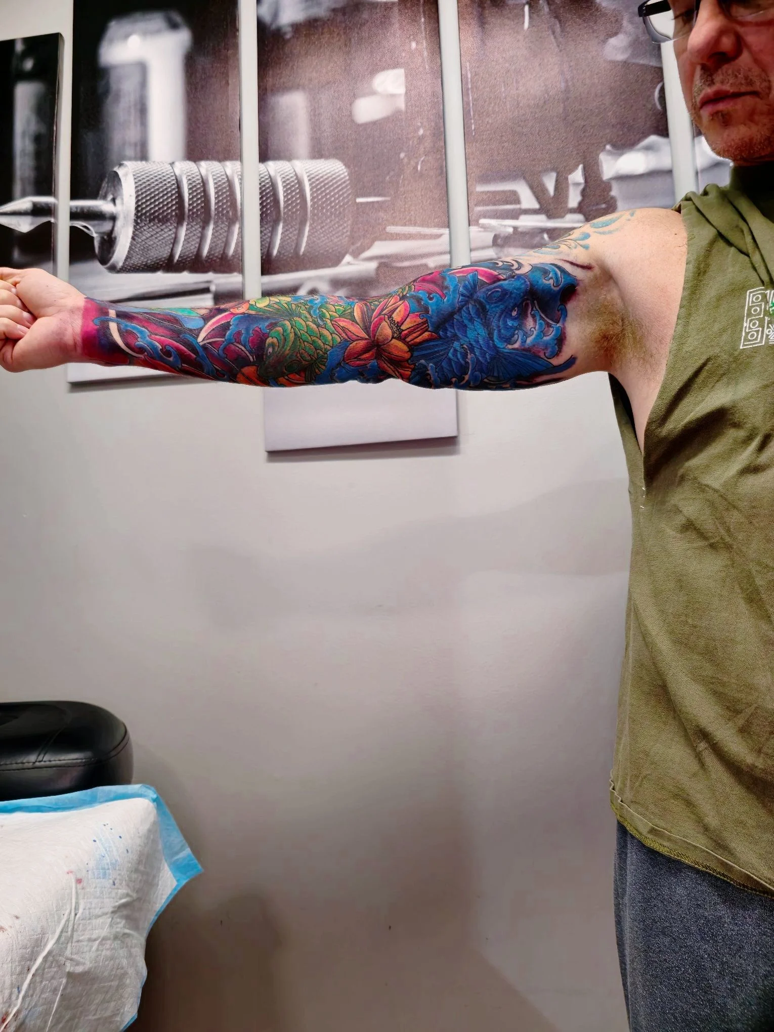 Custom colorful floral and koi fish sleeve tattoo - House of Pain Tattoos Moose Jaw